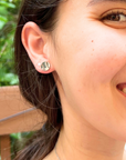 Lifestyle image of cute minimalist baseball stud earrings. Lifestyle image of softball stud earrings.