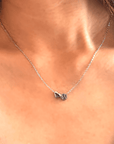 Product close up picture for the "Heart and Baseball" charm necklace in silver