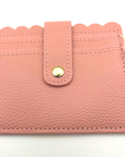 Baseball and softball themed wristlet wallet closeup picture from the frontside with card slots.