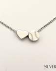 Product close up picture for the Heart and Baseball charm necklace in silver