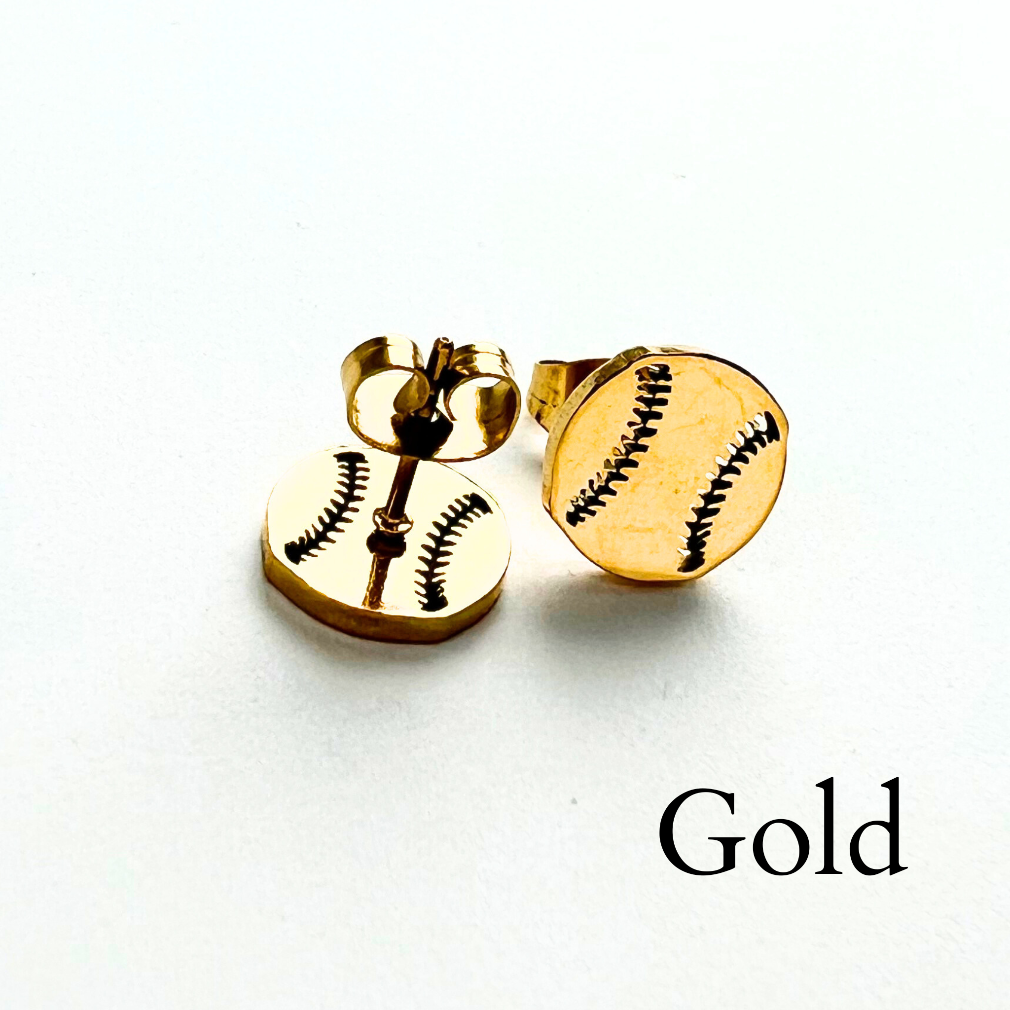Cute minimalist baseball stud earrings in gold. Softball stud earrings in gold