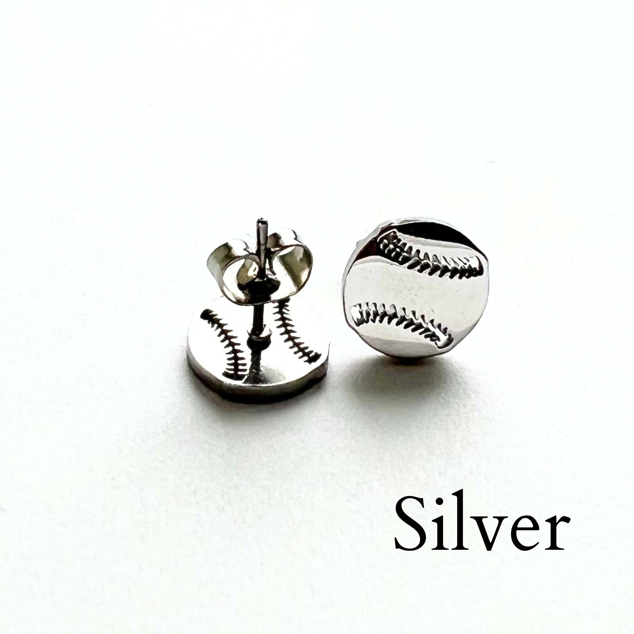 Cute minimalist baseball stud earrings in silver. Softball stud earrings in silver.