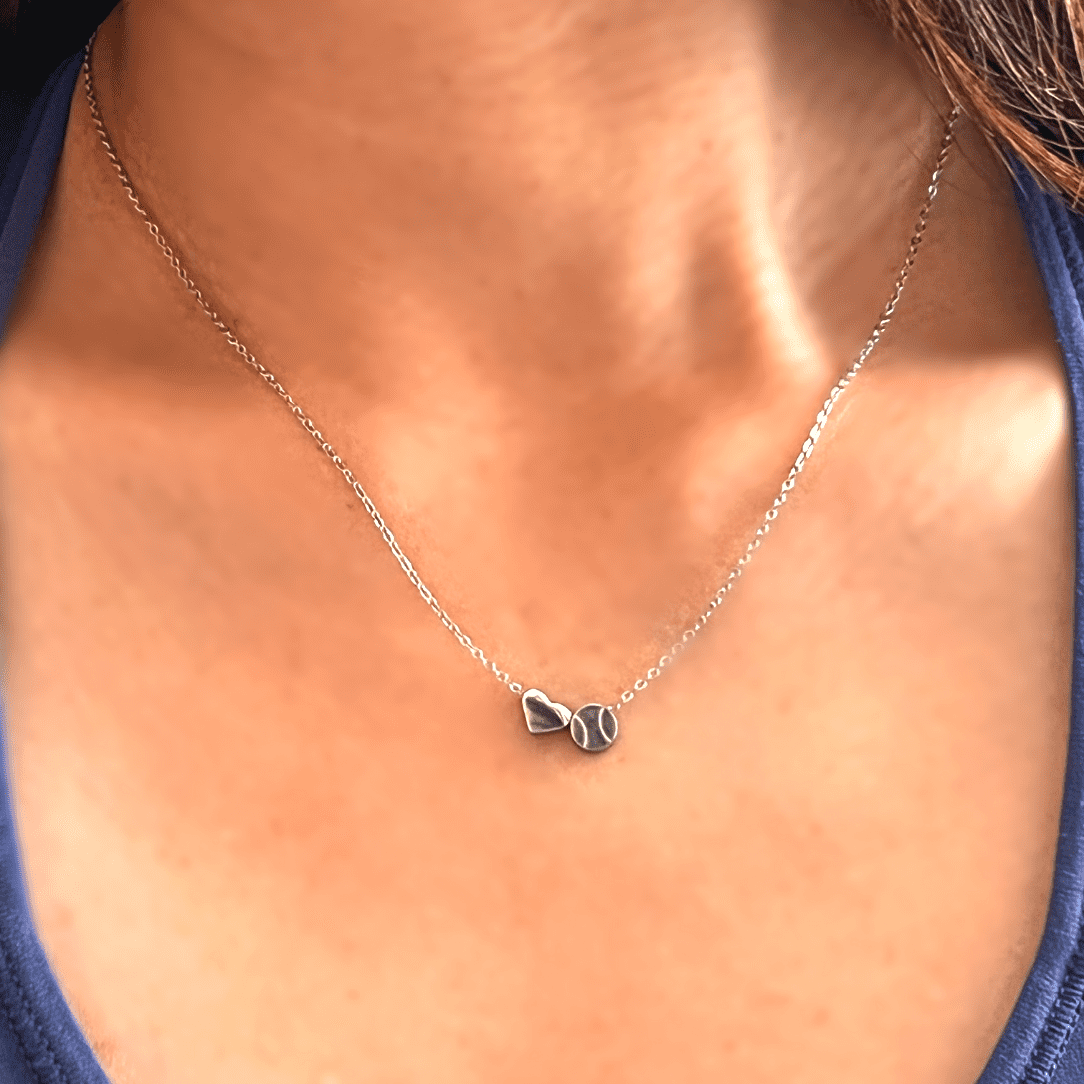Product close up picture for the "Heart and Baseball" charm necklace in silver