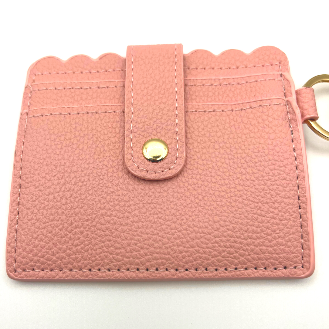Baseball and softball themed wristlet wallet closeup picture from the frontside with card slots.