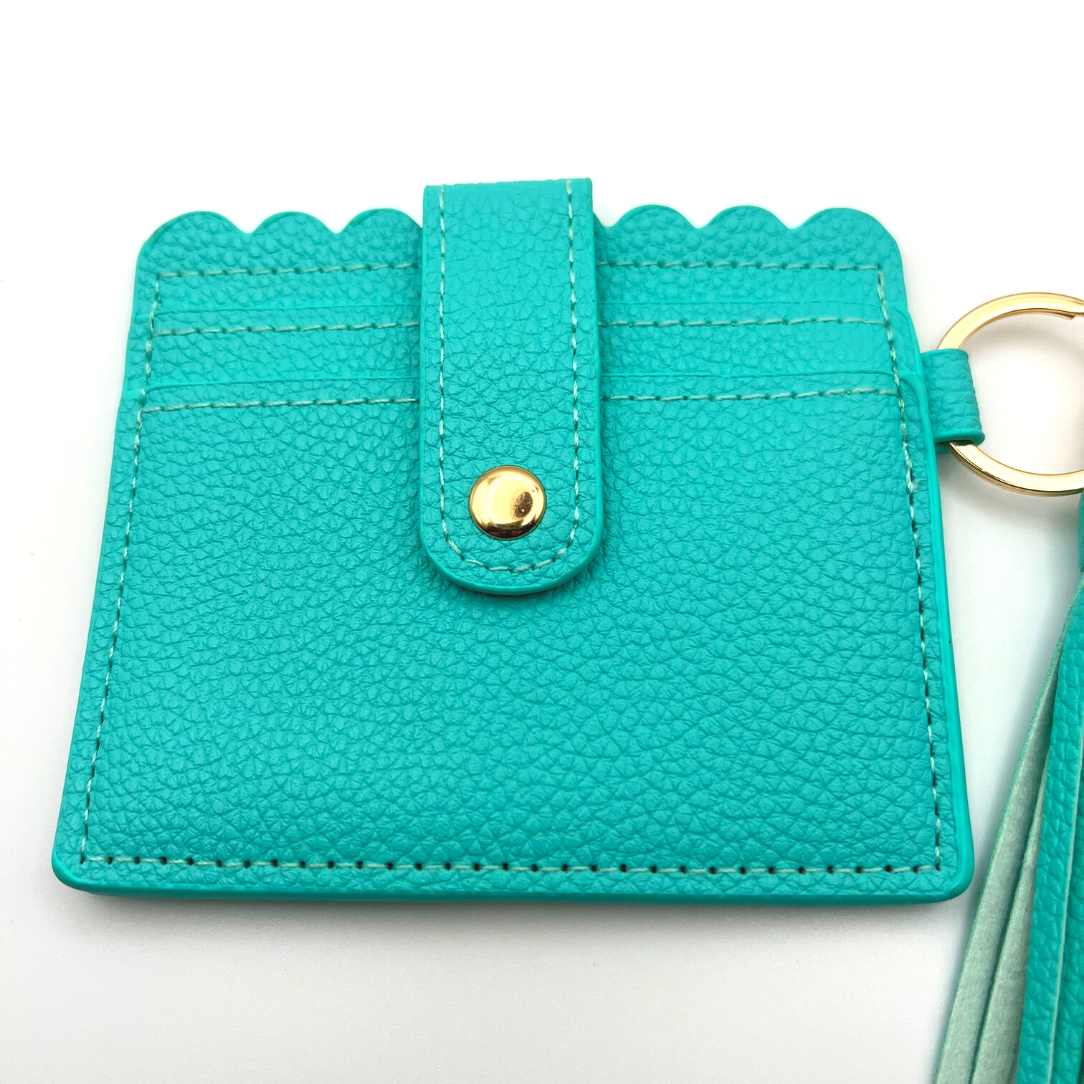 Baseball and softball themed wristlet wallet closeup picture from the frontside with card slots.