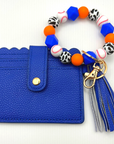 Baseball themed wristlet with wallet and keychain in orange and blue