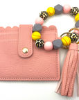 Softball themed wristlet with wallet and keychain in pink